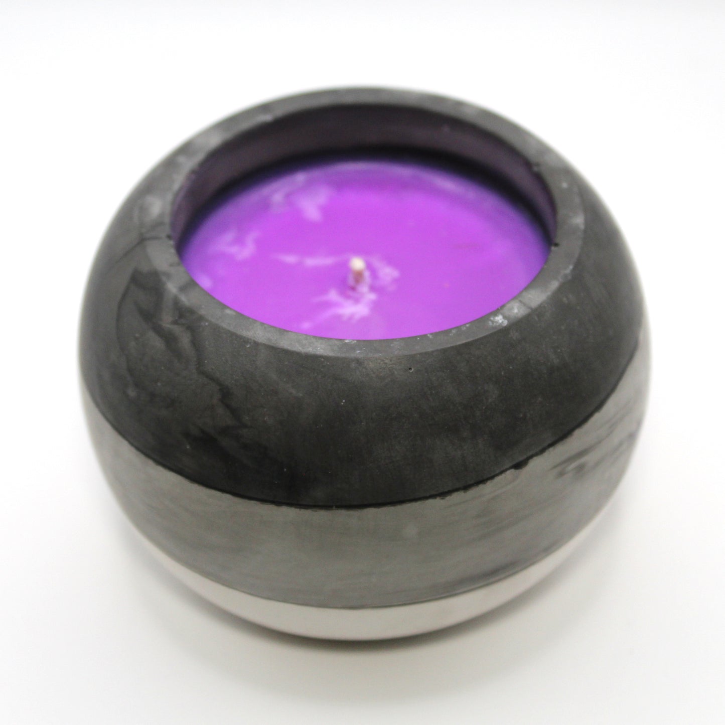 3/4 top-down view of a handcrafted candle holder, showcasing the black, white and grey colors of the asexual pride flag seamlessly blending together with the purple candle clearly visible. Set against a clean white background, this unique design celebrates identity and expression. Ideal for LGBTQ+ home decor, pride gifts, and statement lighting.