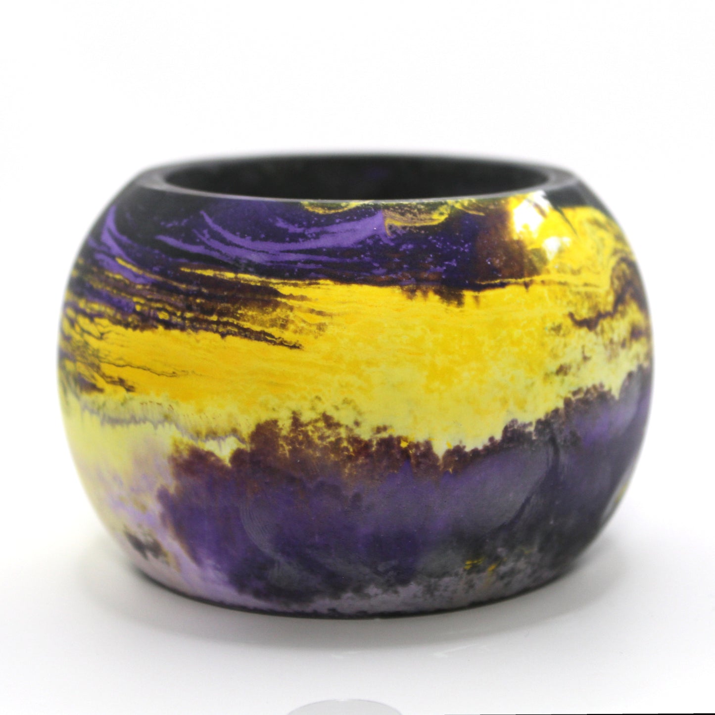 Handcrafted Ecocrete candle holder featuring the black, purple, yellow and white colors of the nonbinary pride flag, elegantly blended together. Set against a clean white background, this unique design celebrates identity and personal expression. Perfect for LGBTQ+ decor, pride gifts, and home ambiance.