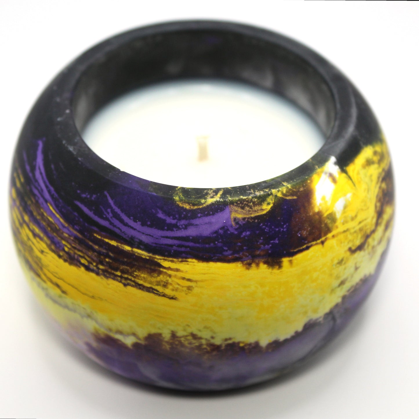 3/4 top-down view of a handcrafted candle holder, showcasing the vibrant colors of the nonbinary pride flag seamlessly blending together with the white candle clearly visible. Set against a clean white background, this unique design celebrates identity and expression. Ideal for LGBTQ+ home decor, pride gifts, and statement lighting.