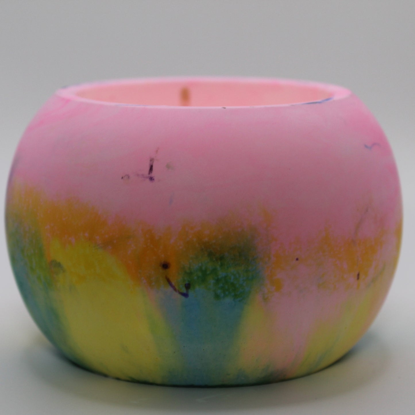 Handcrafted Ecocrete candle holder featuring the pink, yellow, and blue colors of the pansexual pride flag, elegantly blended together. Set against a clean white background, this unique design celebrates identity and personal expression. Perfect for LGBTQ+ decor, pride gifts, and home ambiance.