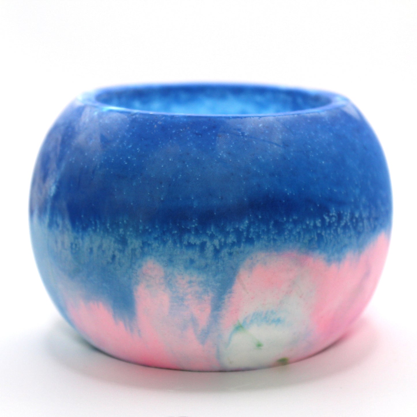 "Handcrafted candle holder featuring the vibrant colors of the transgender pride flag, pink, white and blue elegantly blended together. Set against a clean white background, this unique design celebrates identity and personal expression. Perfect for LGBTQ+ decor, pride gifts, and home ambiance."
