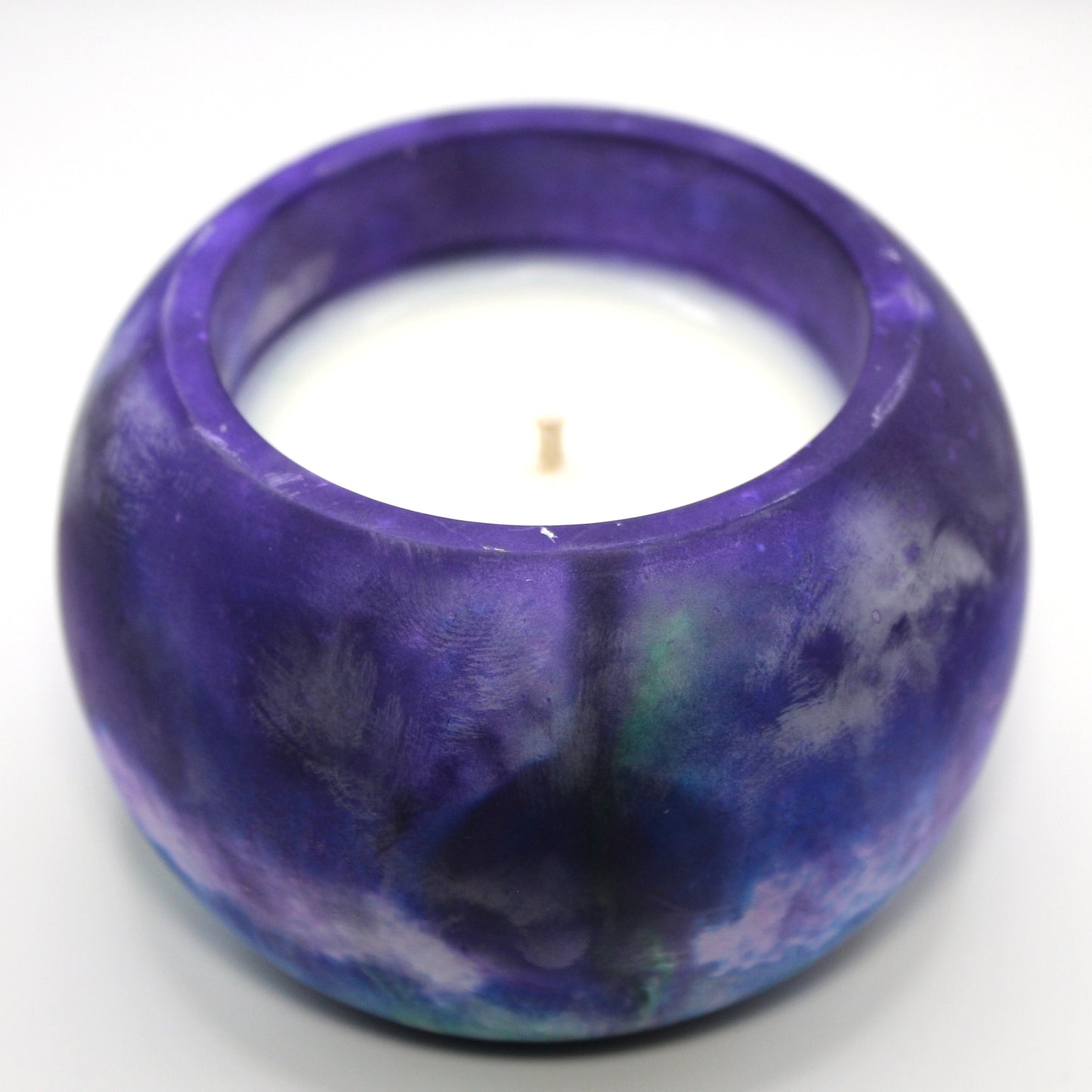3/4 top-down view of a handcrafted candle holder, showcasing the green, white, blue and purple colors of the Trans-Inclusive Gay men's pride flag seamlessly blending together with thewhite candle clearly visible. Set against a clean white background, this unique design celebrates identity and expression. Ideal for LGBTQ+ home decor, pride gifts, and statement lighting.