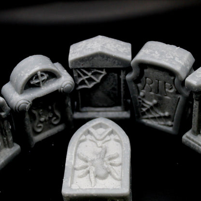 3/4 top-down view of five tombstone-shaped wax melts on a black background, with four standing upright encircling a fifth lying flat in the center. A haunting, gothic aesthetic perfect for spooky home decor, macabre ambiance, and alternative wax melt lovers.