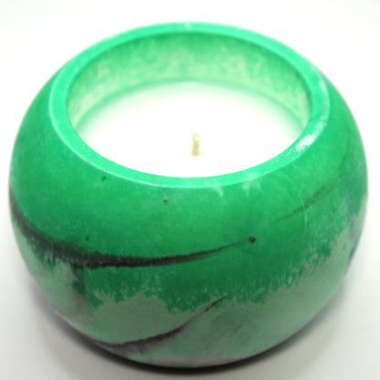 3/4 top-down view of a handcrafted candle holder, showcasing the black, white, and green colors of the agender pride flag seamlessly blending together with the white candle clearly visible. Set against a clean white background, this unique design celebrates identity and expression. Ideal for LGBTQ+ home decor, pride gifts, and statement lighting.