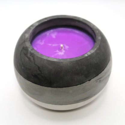 3/4 top-down view of a handcrafted candle holder, showcasing the black, white and grey colors of the asexual pride flag seamlessly blending together with the purple candle clearly visible. Set against a clean white background, this unique design celebrates identity and expression. Ideal for LGBTQ+ home decor, pride gifts, and statement lighting.