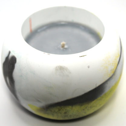 3/4 top-down view of a handcrafted candle holder, showcasing the black, white, and yellow colors of the Demigender pride flag seamlessly blending together with the gray candle clearly visible. Set against a clean white background, this unique design celebrates identity and expression. Ideal for LGBTQ+ home decor, pride gifts, and statement lighting.