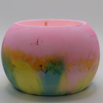 Handcrafted Ecocrete candle holder featuring the pink, yellow, and blue colors of the pansexual pride flag, elegantly blended together. Set against a clean white background, this unique design celebrates identity and personal expression. Perfect for LGBTQ+ decor, pride gifts, and home ambiance.