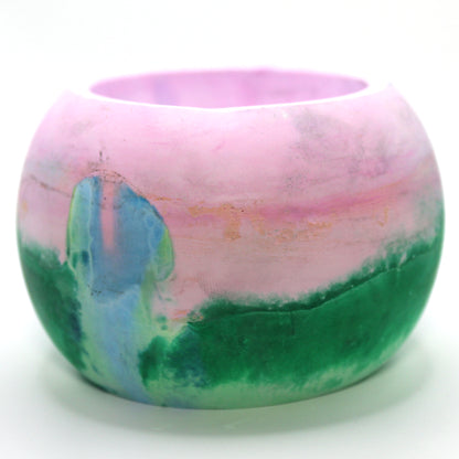 Handcrafted candle holder featuring the vibrant colors of the polysexual pride flag, elegantly blended together. Set against a clean white background, this unique design celebrates identity and personal expression. Perfect for LGBTQ+ decor, pride gifts, and home ambiance.